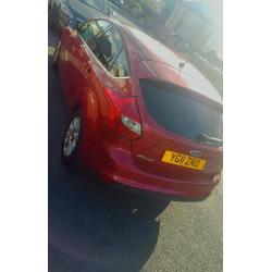 **2011Red Ford focus** 1.6 tdcu titanium 5door.