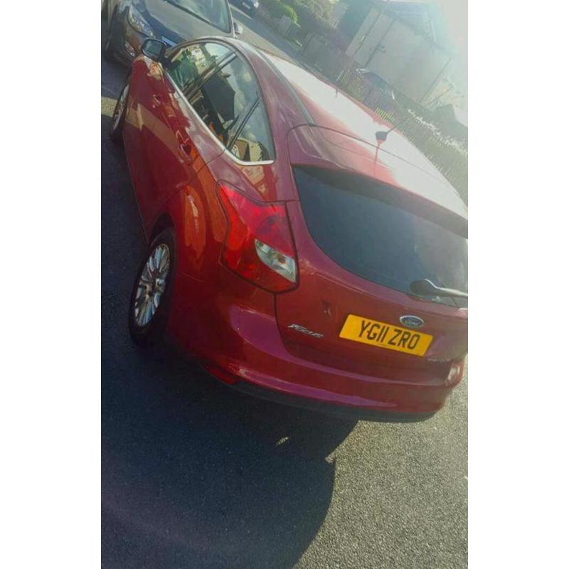 **2011Red Ford focus** 1.6 tdcu titanium 5door.