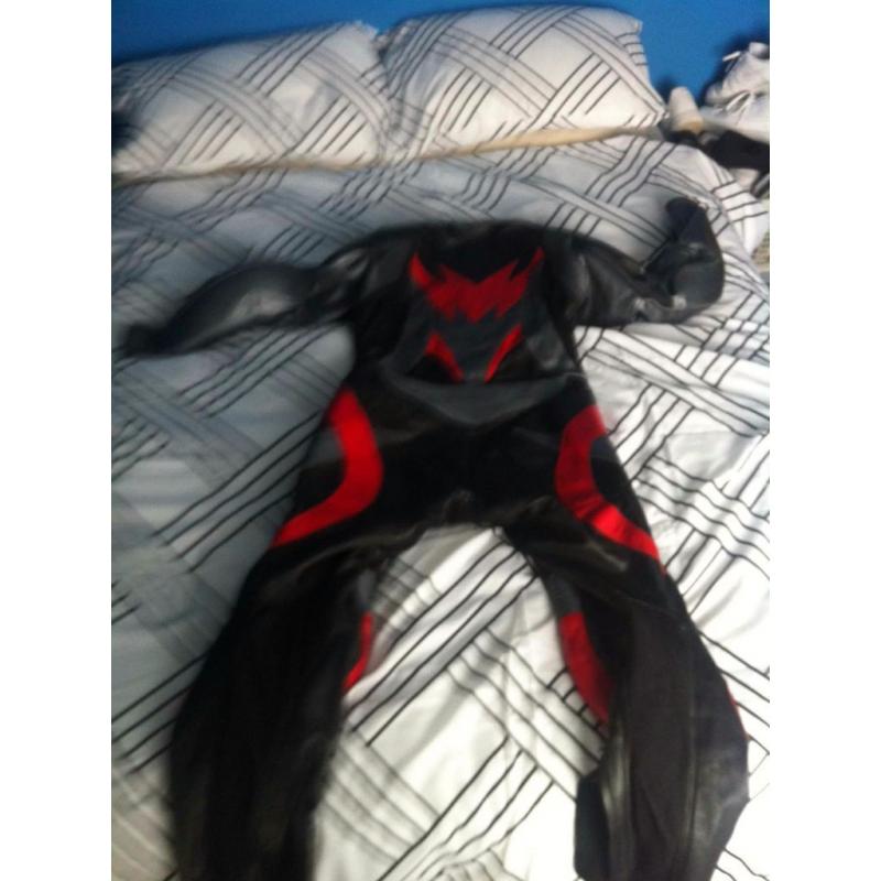 Size 44 Buffalo one piece leather suit, red and black. Leathers.