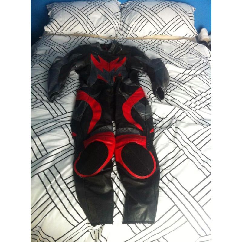 Size 44 Buffalo one piece leather suit, red and black. Leathers.