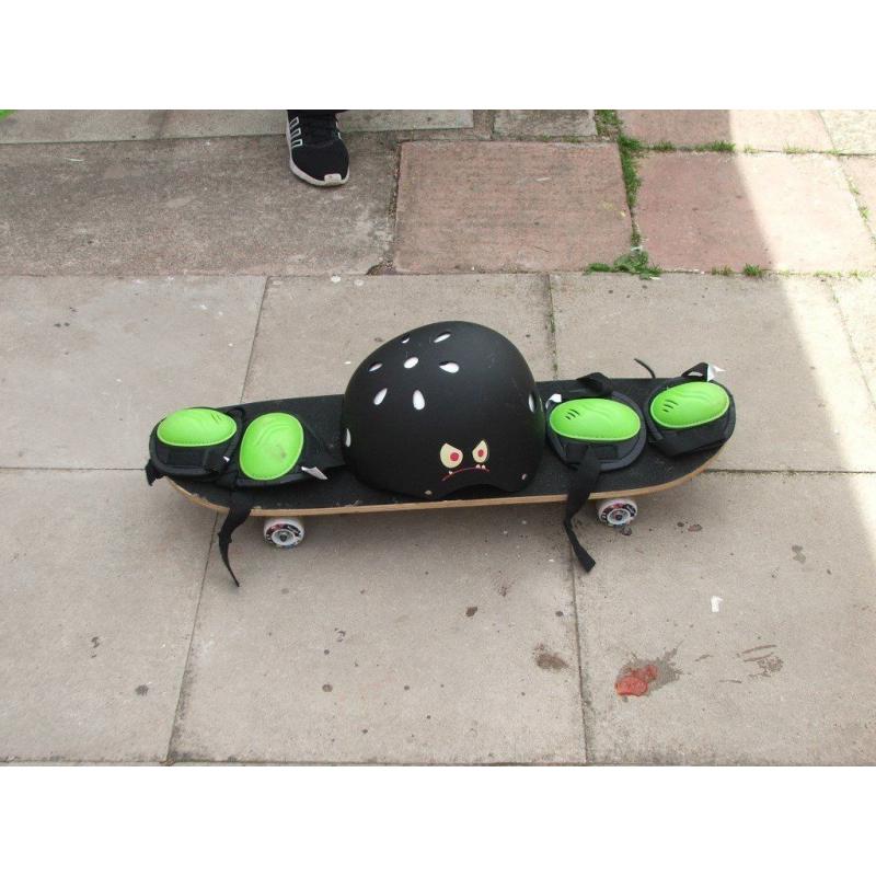 skatboard with helmelt and pads
