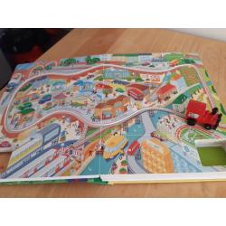 Usborne Interactive Book with wind up working train amd multiple pages of tracks to play on.