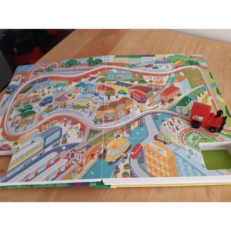 Usborne Interactive Book with wind up working train amd multiple pages of tracks to play on.