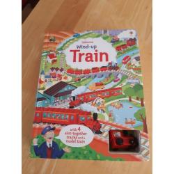 Usborne Interactive Book with wind up working train amd multiple pages of tracks to play on.